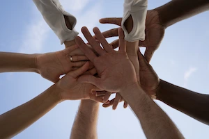 Mondaycloud join our mission, hands together